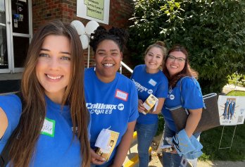 Four CoWorx employees smiling taking a selfie