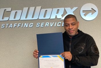 CoWorx employee showing off certificate